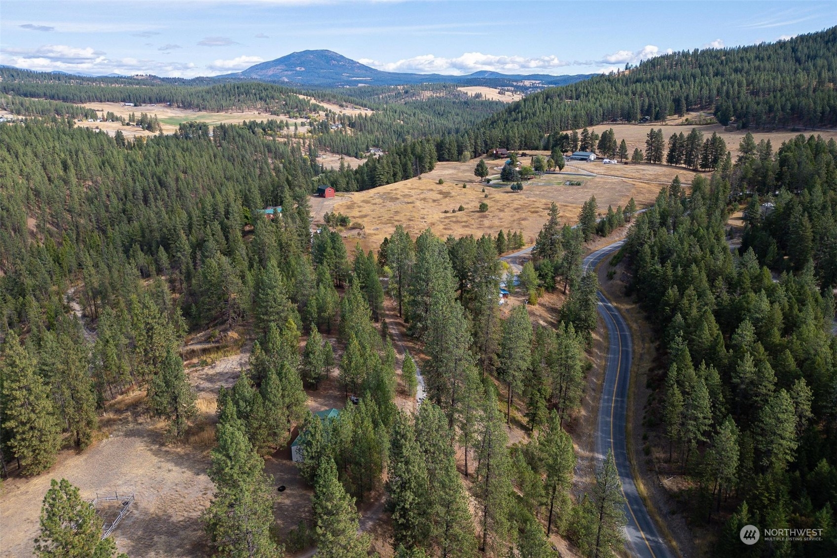 745 D Hall Road Colville, WA 99114 - Photo 27 of 27 a view of a town with mountains in the background