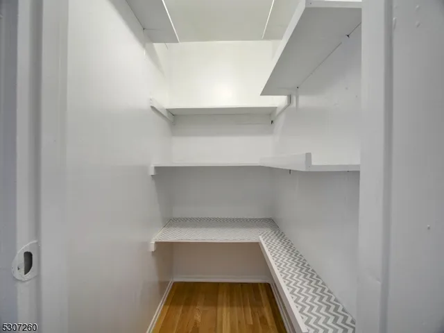 a hallway with wooden floor