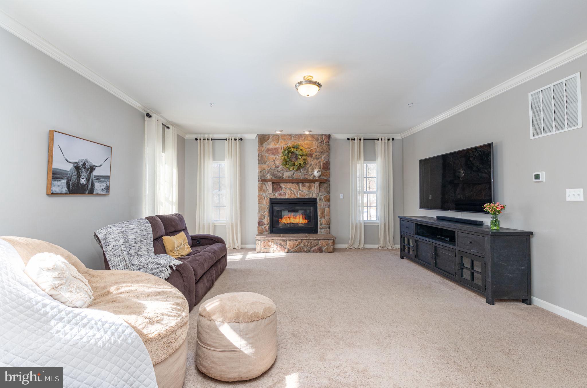 4759 Carea Road White Hall, MD 21161 - Photo 12 of 40 Stone backed gas fireplace with wood mantle