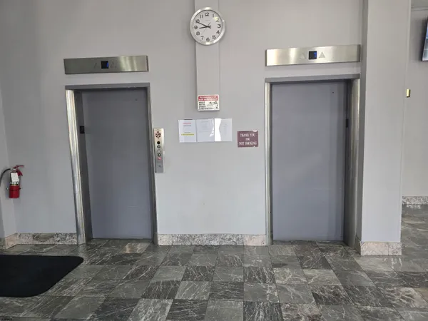 a view of a hallway with elevator