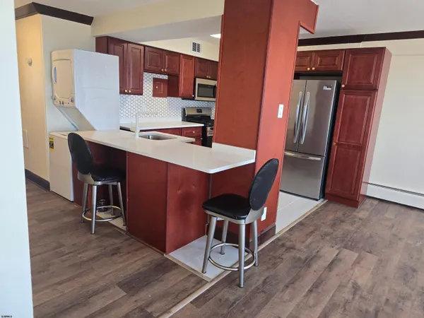 a view of a dining room with furniture and wooden floor