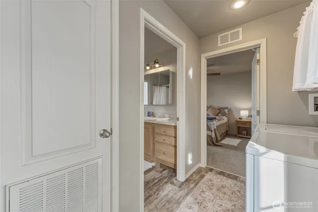 a en suite bathroom with a sink and a mirror