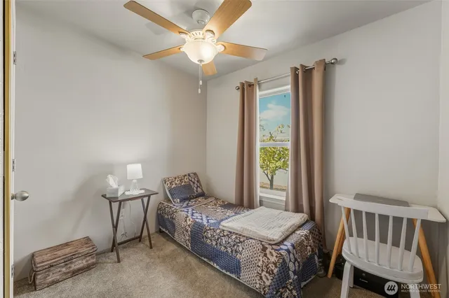 a bedroom with bed and a window