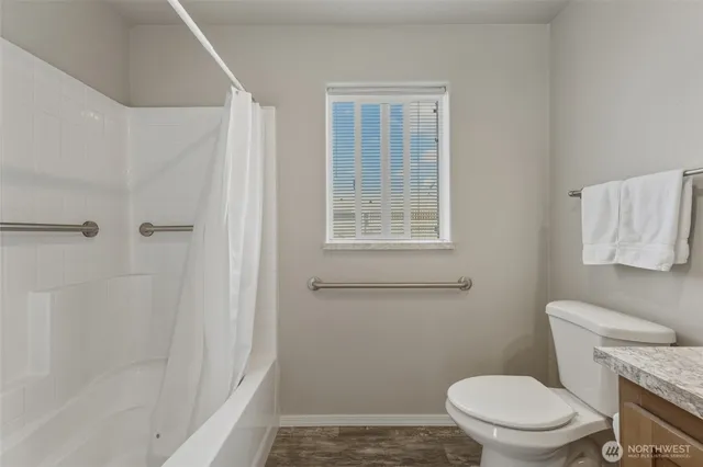 a white toilet sitting next to a bathroom sink