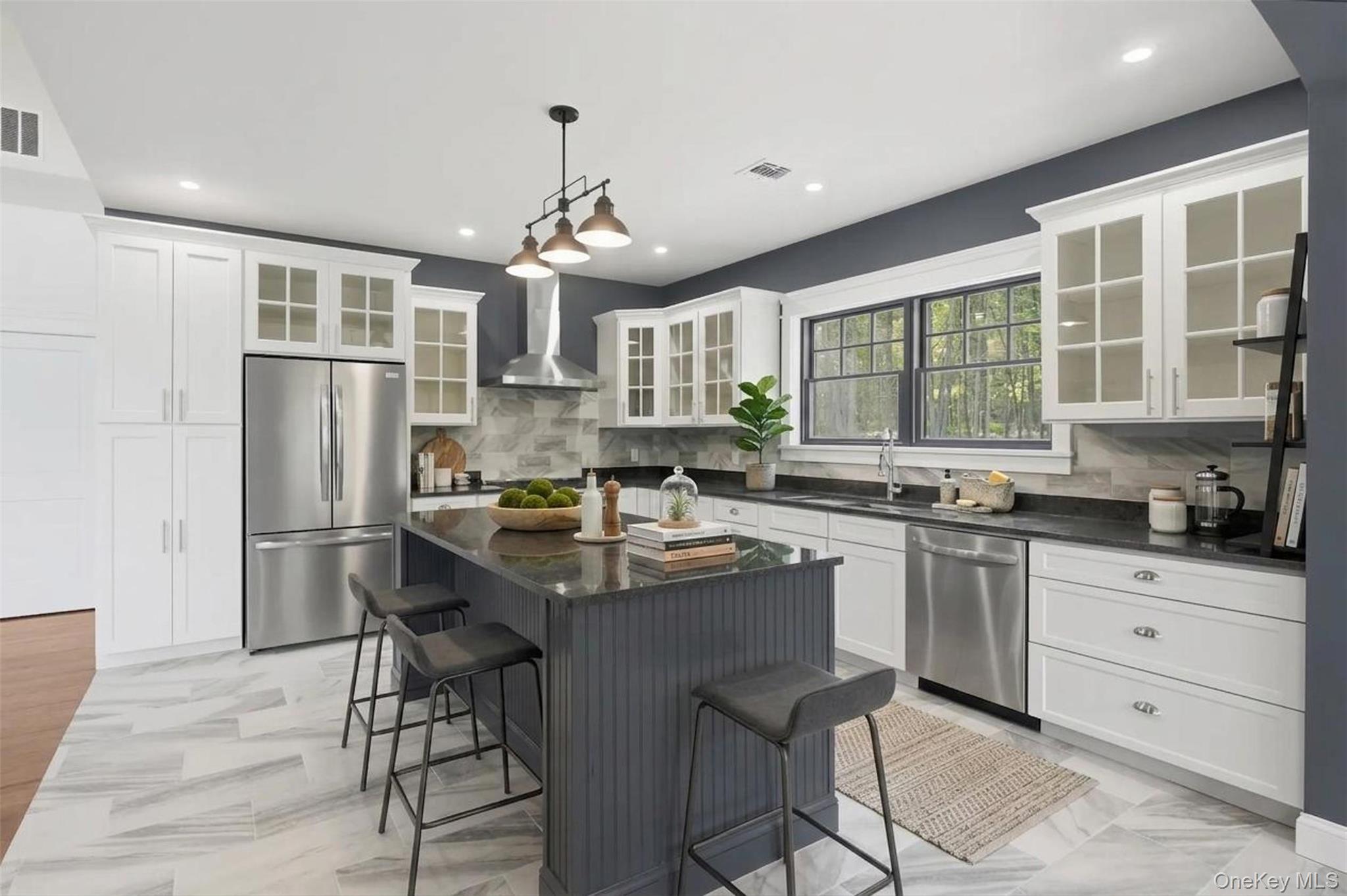 300 Van Tuyl Road Barryville, NY 12719 - Photo 8 of 50 a kitchen with stainless steel appliances granite countertop a stove a refrigerator a sink a dining table and chairs with wooden floor