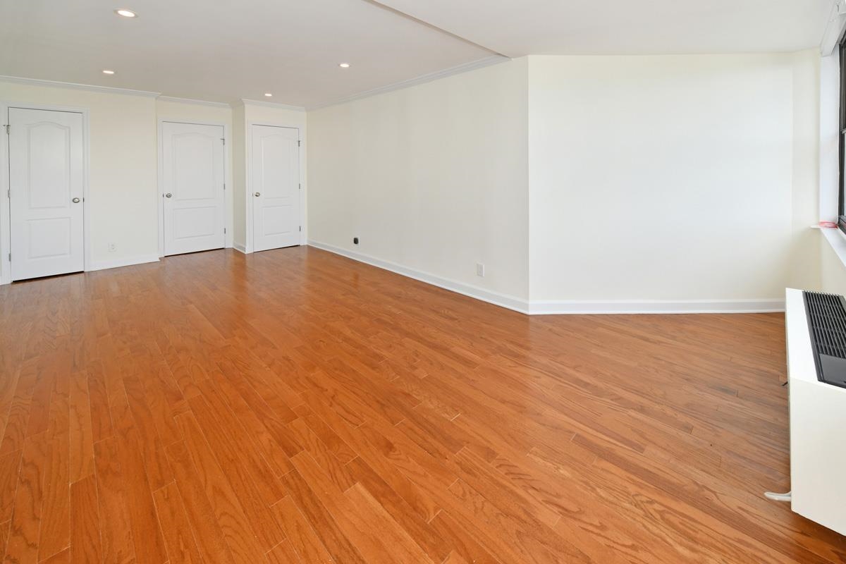 7000 Boulevard East, Unit 43H Guttenberg, NJ 07093 - Photo 7 of 8 a view of empty room with wooden floor