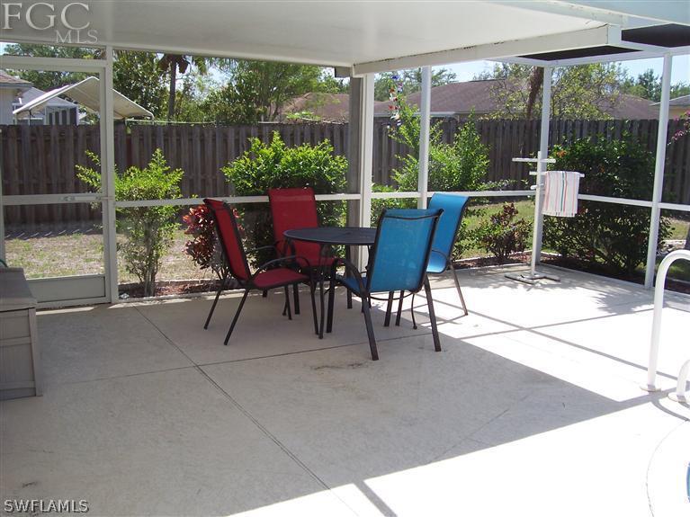 15669 Spring Line Lane Fort Myers, FL 33905 - Photo 3 of 13 a view of a two chairs and table in the patio