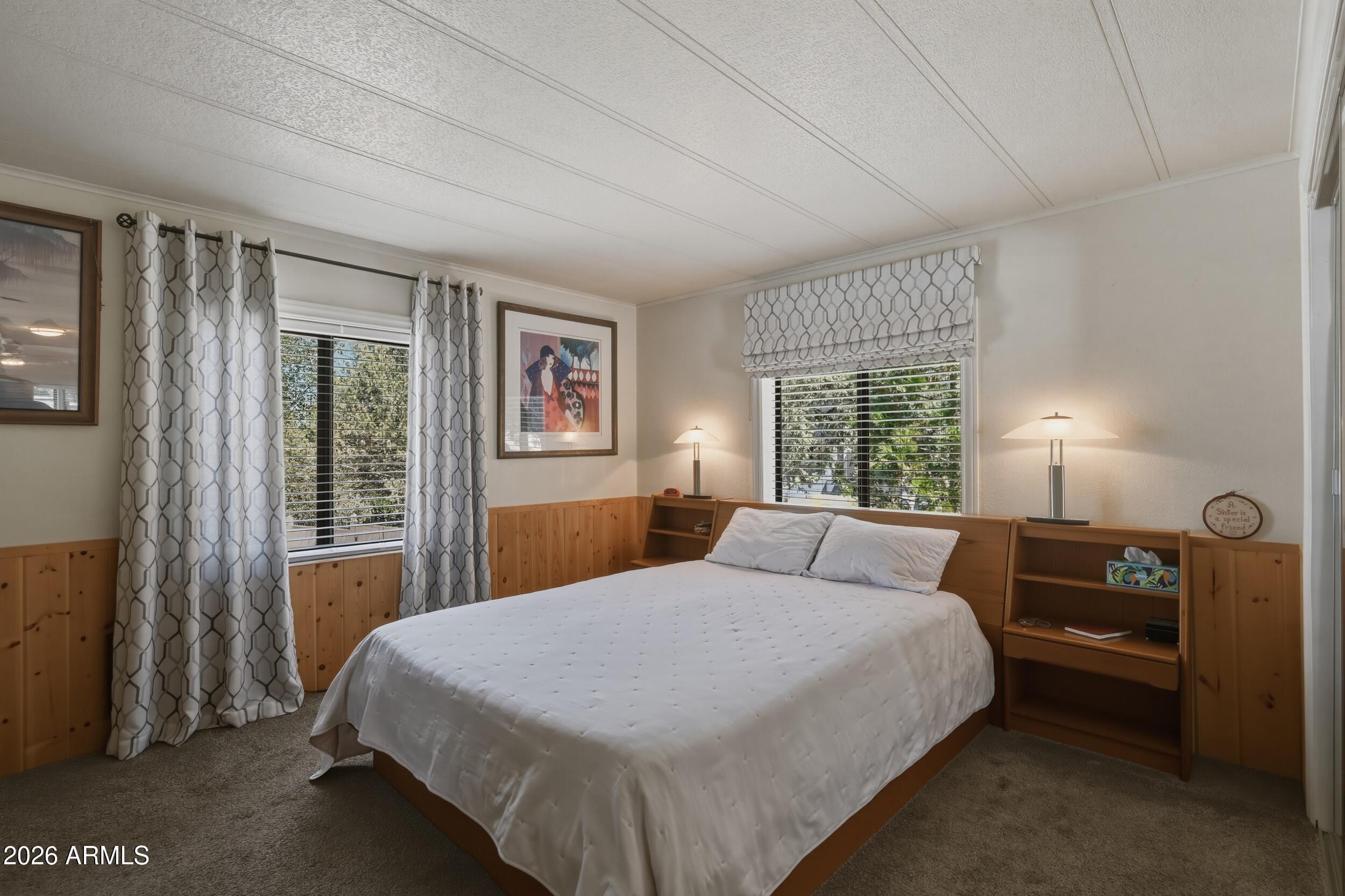 1108 North William Tell Circle Payson, AZ 85541 - Photo 22 of 32 a bedroom with a large bed and a window