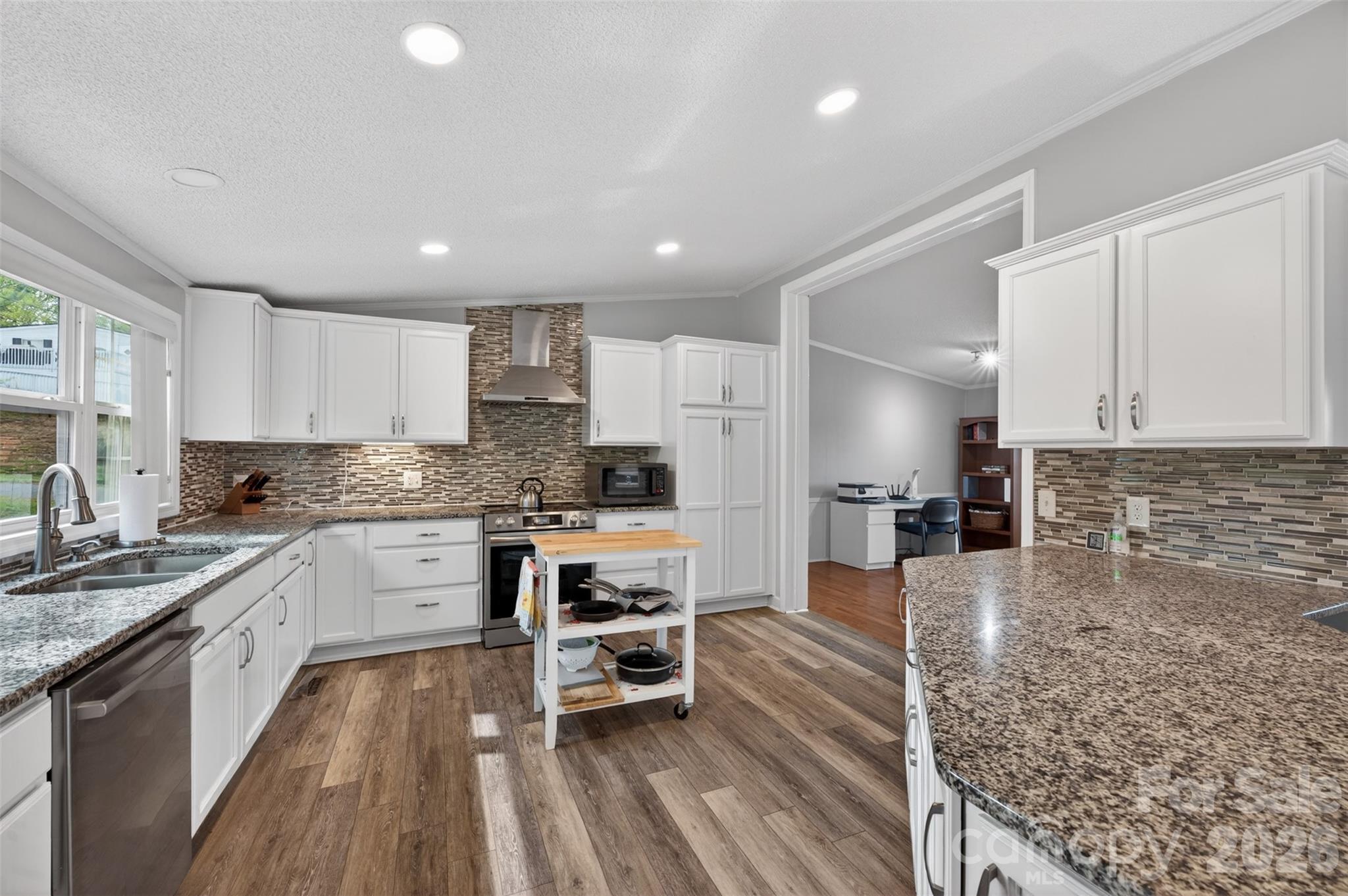 4352 Anderson Mountain Road Maiden, NC 28650 - Photo 12 of 42 a large kitchen with cabinets