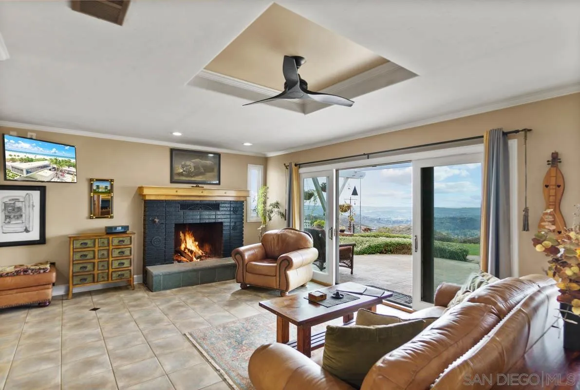 14770 High Valley Road Poway, CA 92064 - Photo 12 of 32 a living room with furniture and a fireplace