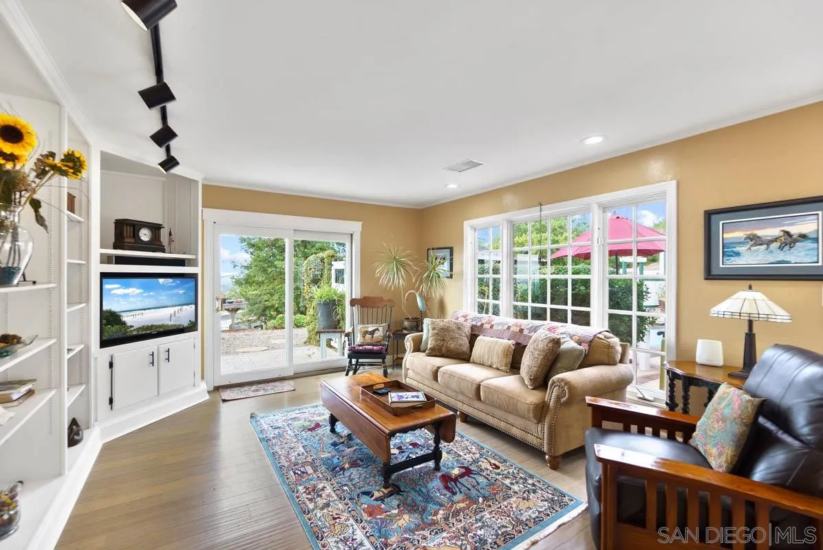 14770 High Valley Road Poway, CA 92064 - Photo 15 of 32 a living room with furniture and a flat screen tv