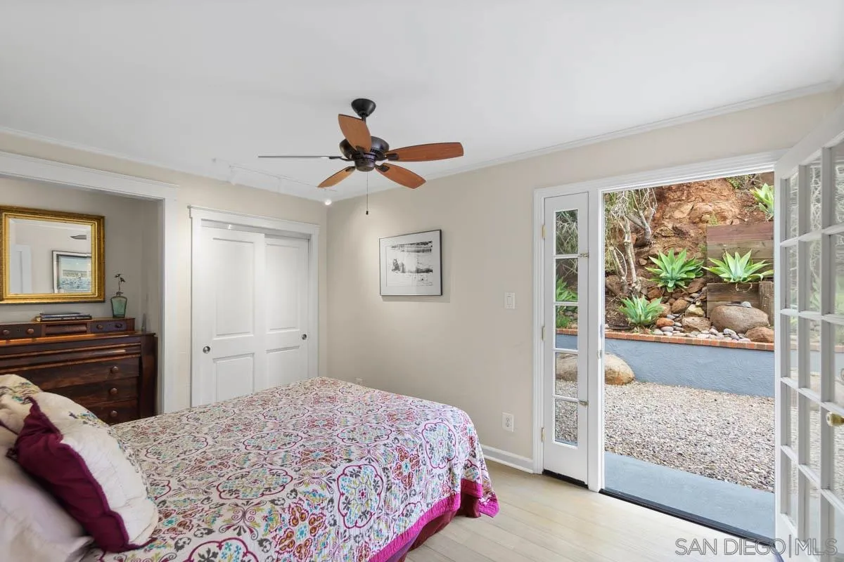 14770 High Valley Road Poway, CA 92064 - Photo 19 of 32 a bedroom with a bed and a dresser