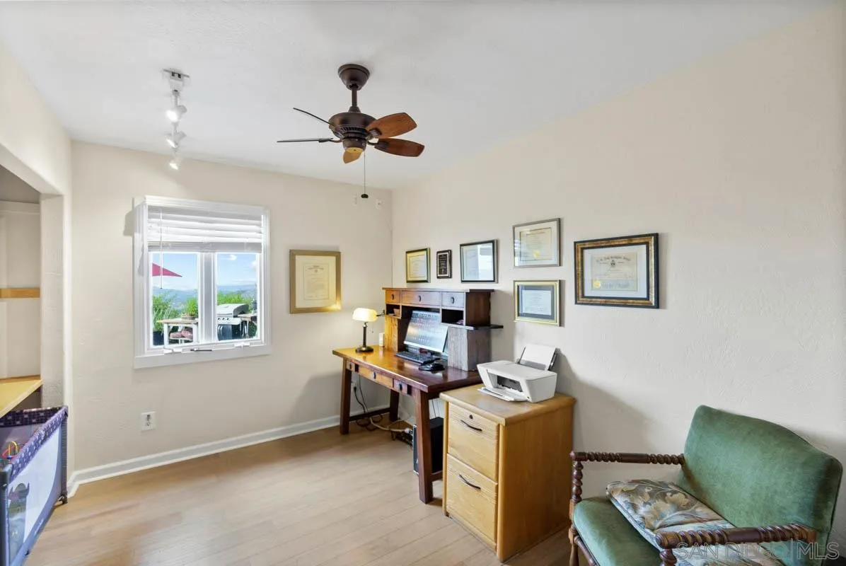 14770 High Valley Road Poway, CA 92064 - Photo 20 of 32 a living room with furniture and a window