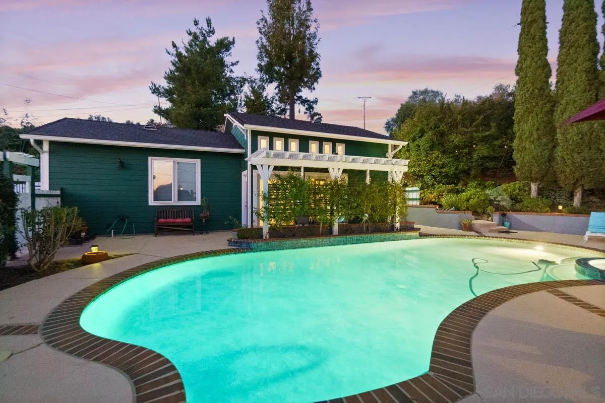 14770 High Valley Road Poway, CA 92064 - Photo 21 of 32 a view of a house with backyard sitting area and swimming pool