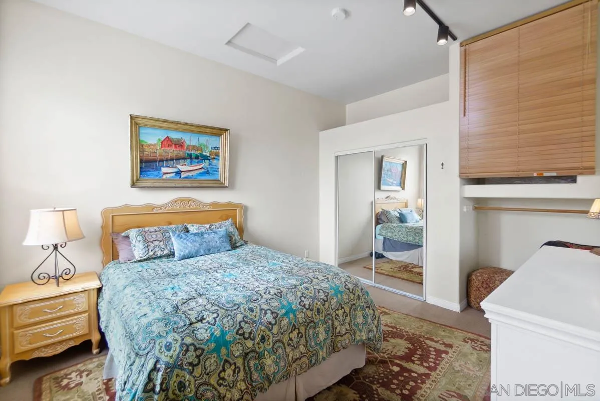 14770 High Valley Road Poway, CA 92064 - Photo 25 of 32 a bedroom with a bed and a painting on the wall