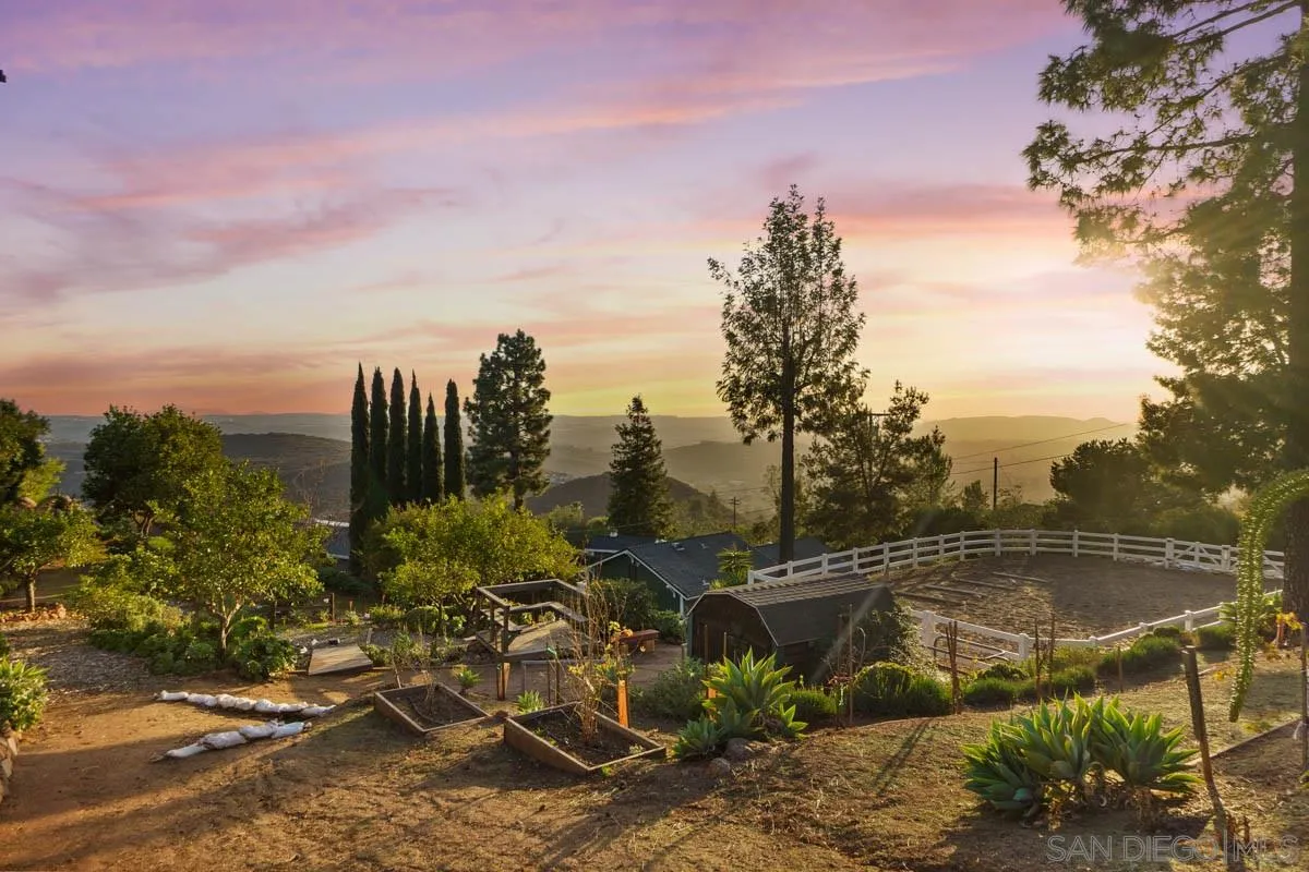 14770 High Valley Road Poway, CA 92064 - Photo 3 of 32 a view of a swimming pool with a yard and plants
