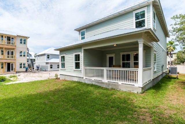44 Grande Pointe Drive Inlet Beach, FL 32461 - Photo 27 of 54 a view of a house with a yard and deck