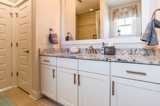44 Grande Pointe Drive Inlet Beach, FL 32461 - Photo 32 of 54 a bathroom with a granite countertop sink and a mirror