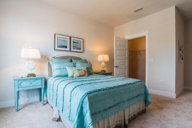 44 Grande Pointe Drive Inlet Beach, FL 32461 - Photo 35 of 54 a bedroom with a bed and a lamp on table