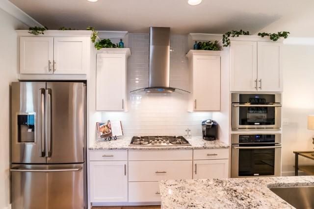 44 Grande Pointe Drive Inlet Beach, FL 32461 - Photo 40 of 54 a kitchen with a refrigerator and a stove top oven
