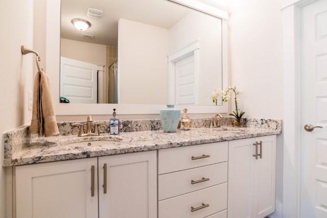 44 Grande Pointe Drive Inlet Beach, FL 32461 - Photo 46 of 54 a bathroom with a granite countertop sink double and mirror