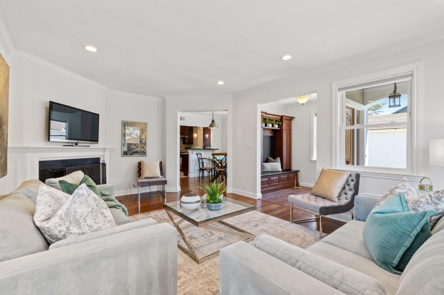 916 Linden Avenue Burlingame, CA 94010 - Photo 11 of 56 a living room with furniture and a flat screen tv