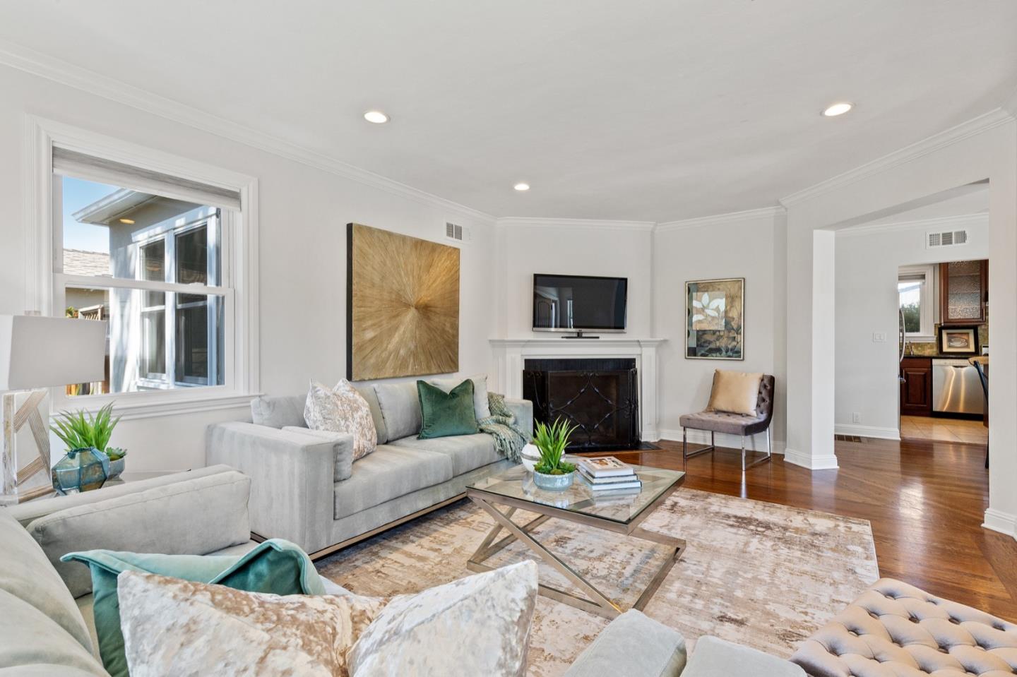 916 Linden Avenue Burlingame, CA 94010 - Photo 12 of 56 a living room with furniture and a fireplace