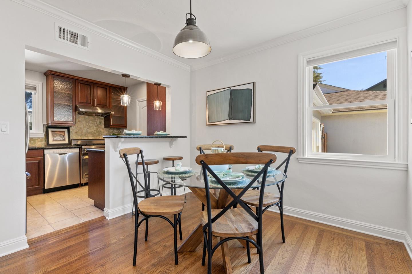 916 Linden Avenue Burlingame, CA 94010 - Photo 13 of 56 a view of a dining room with furniture and wooden floor