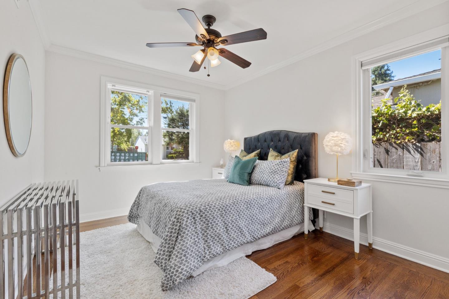 916 Linden Avenue Burlingame, CA 94010 - Photo 19 of 56 a bedroom with a bed and a chandelier