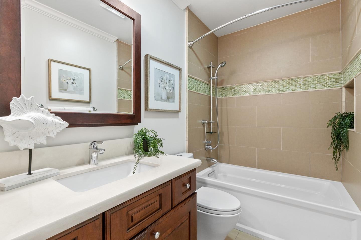 916 Linden Avenue Burlingame, CA 94010 - Photo 22 of 56 a bathroom with a granite countertop sink a toilet and shower