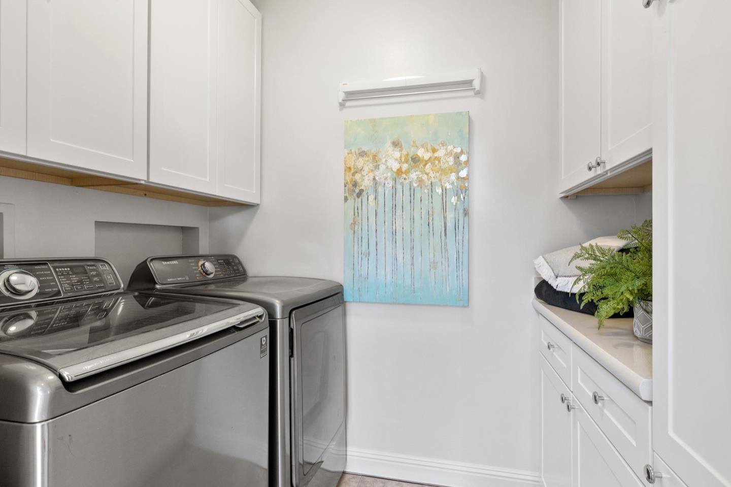 916 Linden Avenue Burlingame, CA 94010 - Photo 24 of 56 a kitchen with stainless steel appliances granite countertop white cabinets and a stove