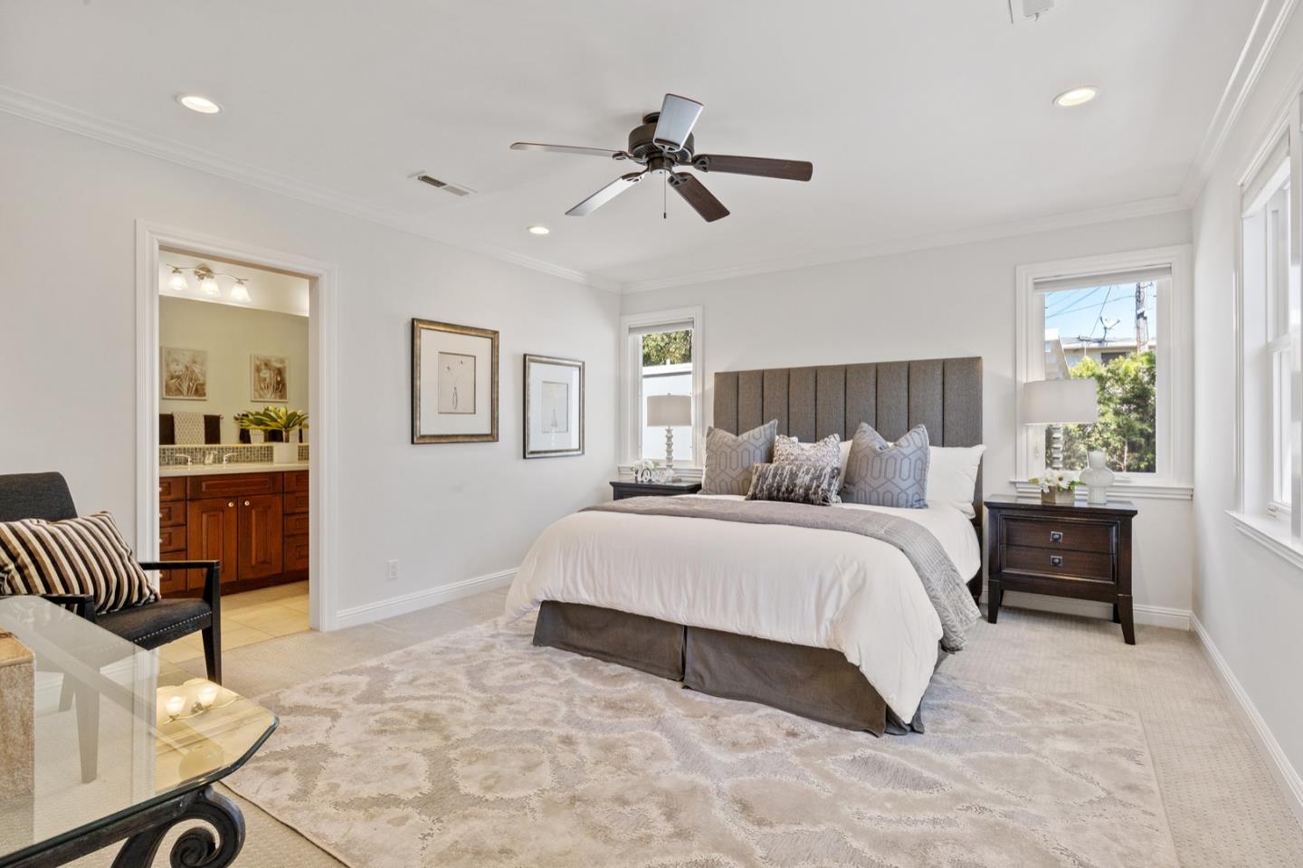 916 Linden Avenue Burlingame, CA 94010 - Photo 25 of 56 a spacious bedroom with a bed and furniture