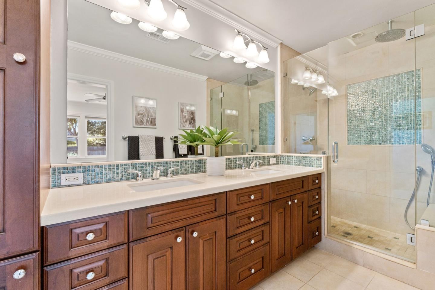 916 Linden Avenue Burlingame, CA 94010 - Photo 30 of 56 a bathroom with a double vanity sink mirror and shower