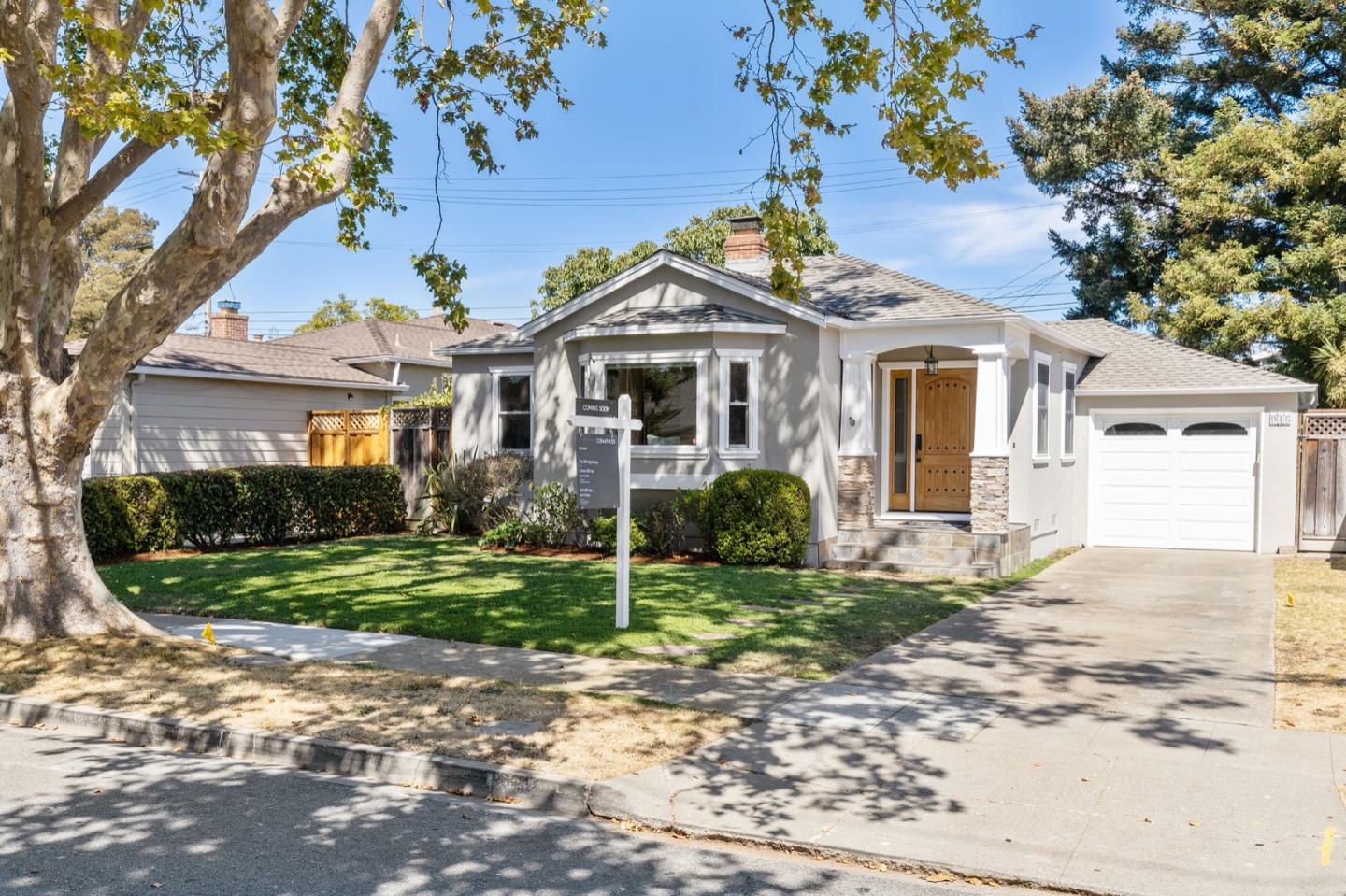916 Linden Avenue Burlingame, CA 94010 - Photo 3 of 56 a front view of a house with a yard and potted plants