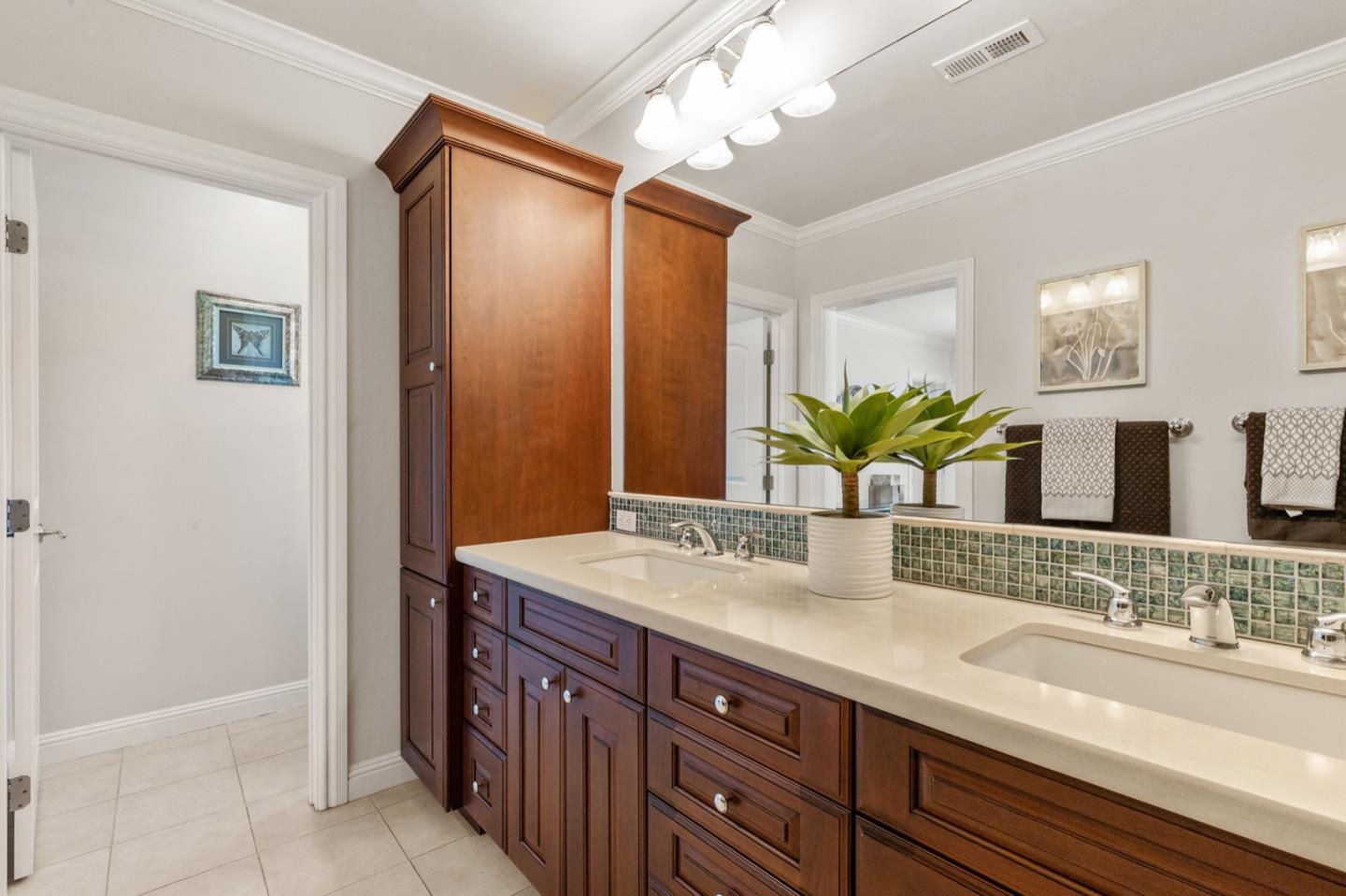 916 Linden Avenue Burlingame, CA 94010 - Photo 32 of 56 a bathroom with a granite countertop sink and a mirror