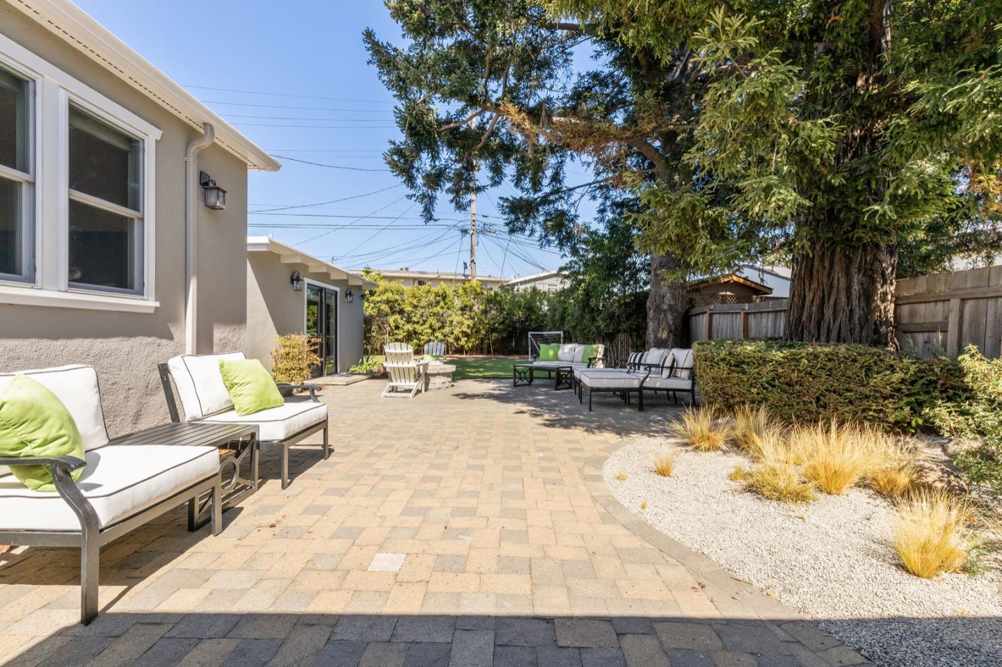 916 Linden Avenue Burlingame, CA 94010 - Photo 35 of 56 a view of a patio with table and chairs and potted plants with wooden floor