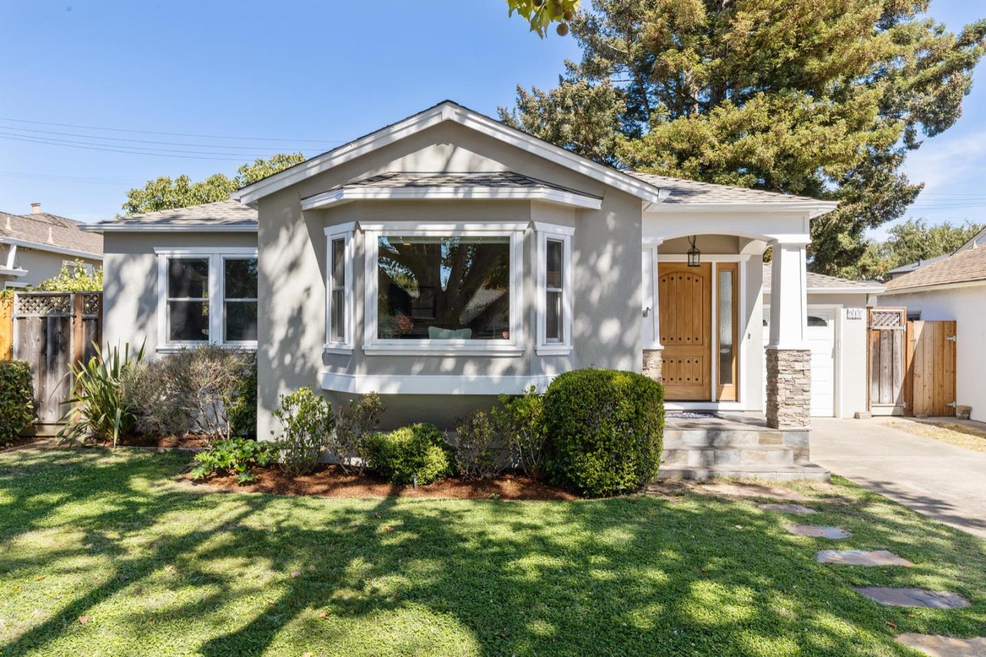 916 Linden Avenue Burlingame, CA 94010 - Photo 4 of 56 a front view of a house with a yard