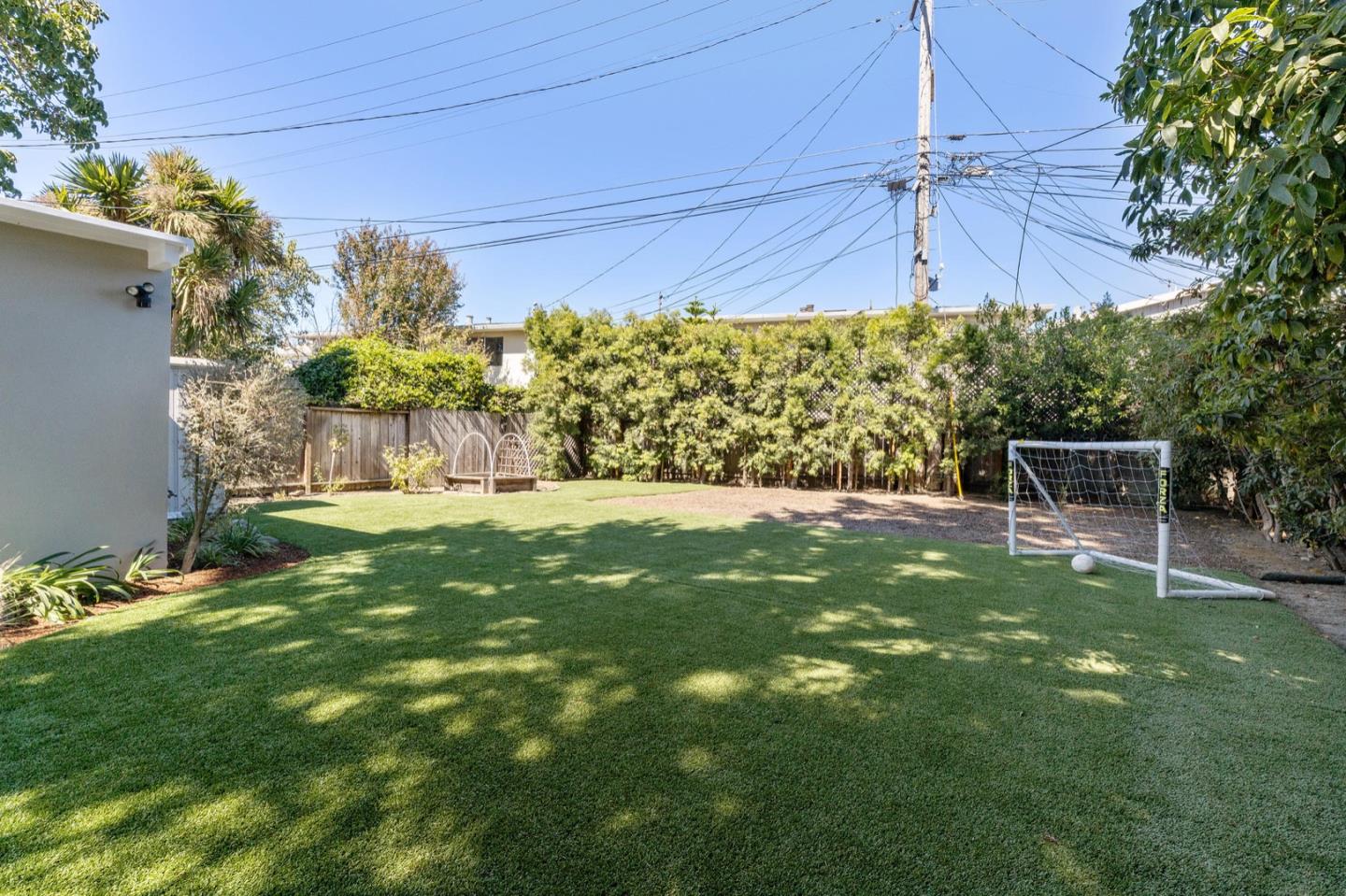 916 Linden Avenue Burlingame, CA 94010 - Photo 41 of 56 a view of a chair and table in the yard