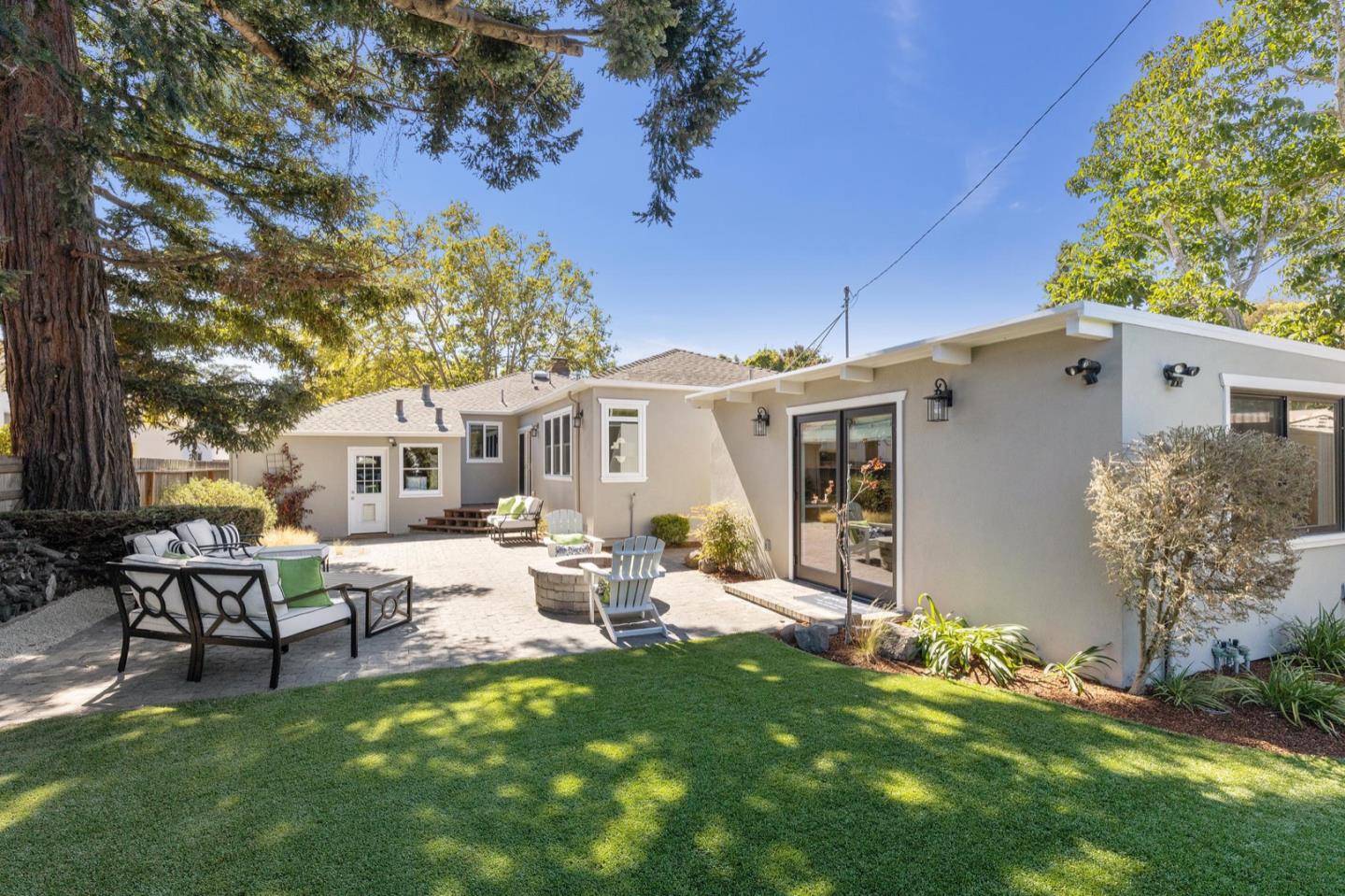 916 Linden Avenue Burlingame, CA 94010 - Photo 42 of 56 a backyard of a house with table and chairs