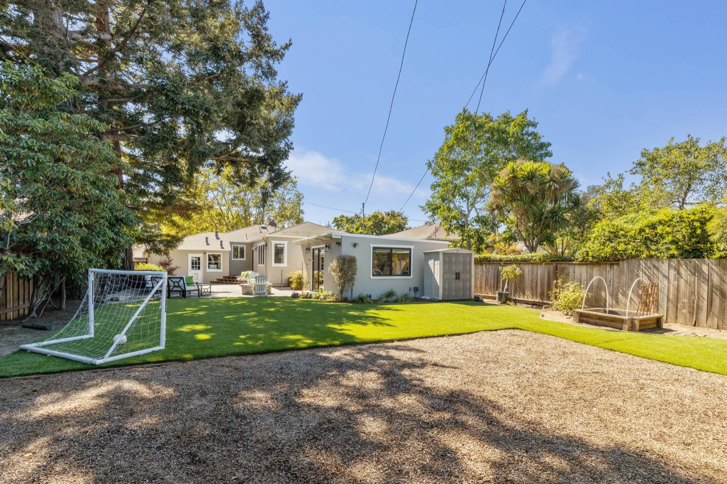 916 Linden Avenue Burlingame, CA 94010 - Photo 43 of 56 a front view of a house with a yard table and chairs