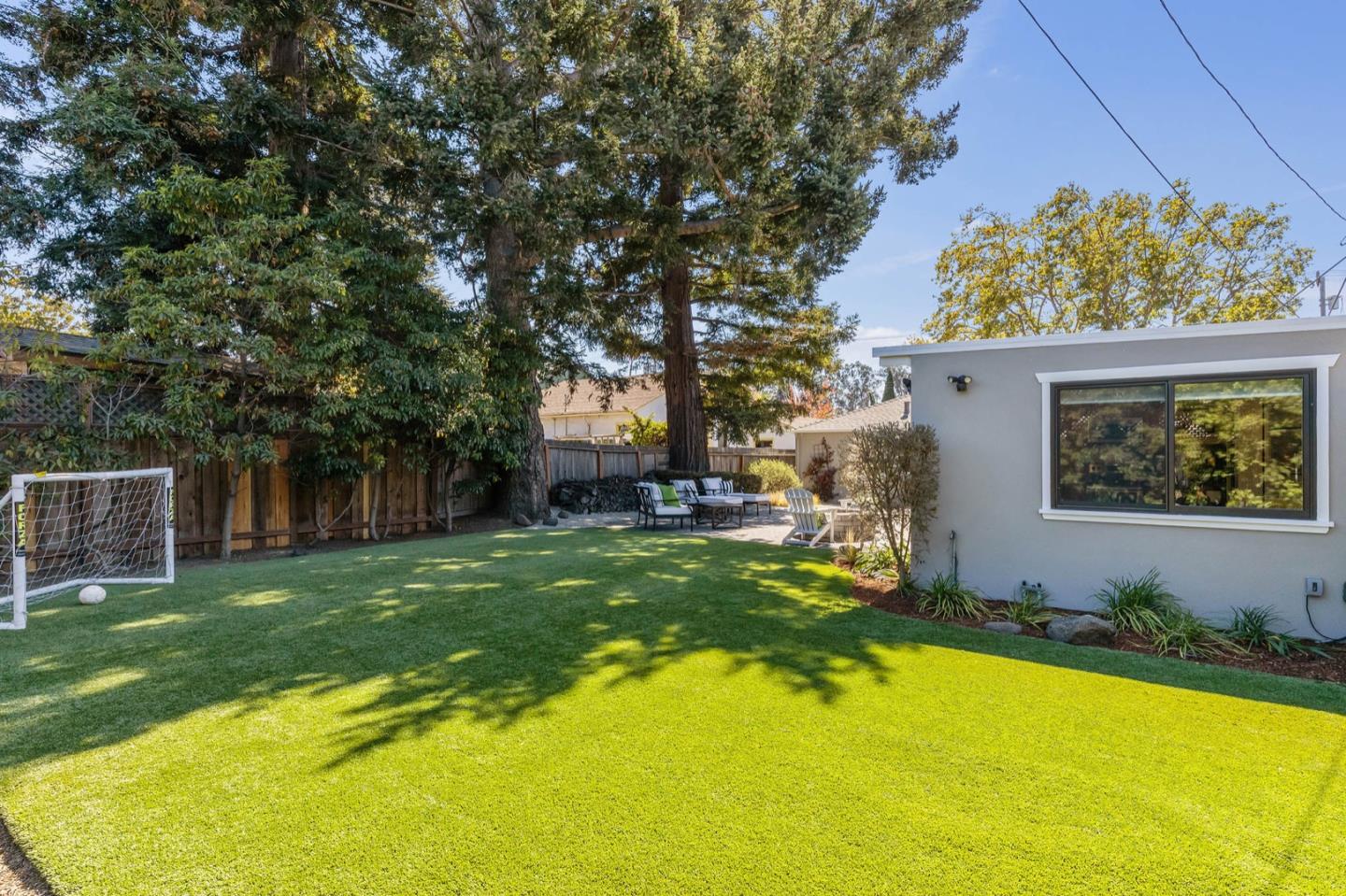 916 Linden Avenue Burlingame, CA 94010 - Photo 45 of 56 a view of a house with swimming pool and a yard