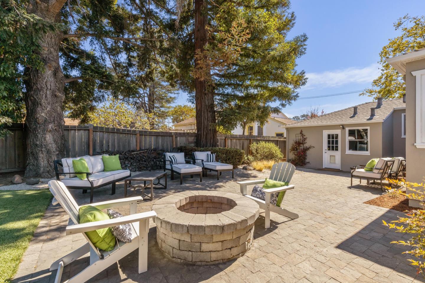 916 Linden Avenue Burlingame, CA 94010 - Photo 47 of 56 a view of a patio with a table chairs and a fire pit