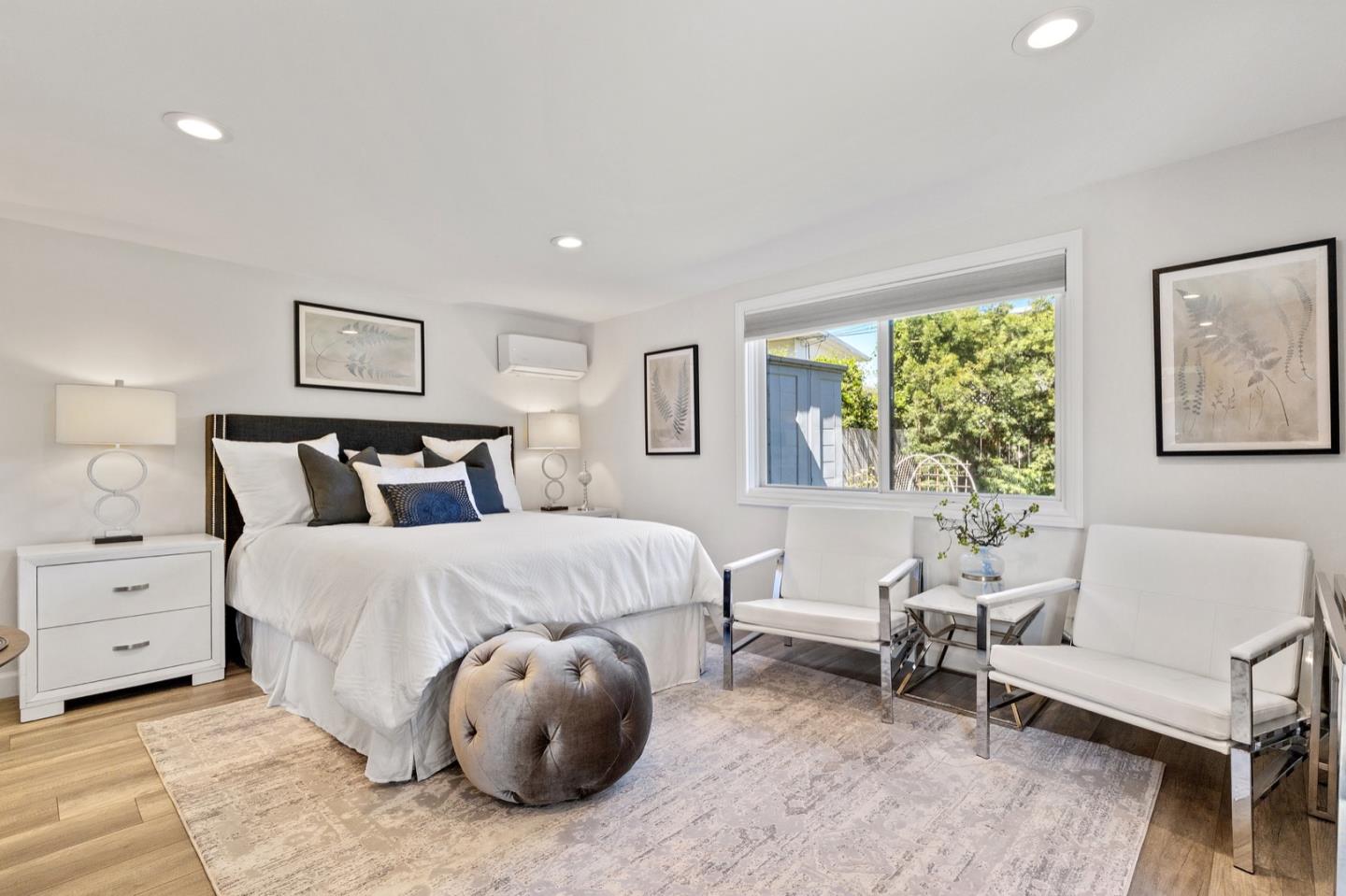 916 Linden Avenue Burlingame, CA 94010 - Photo 48 of 56 a spacious bedroom with a bed and a couch