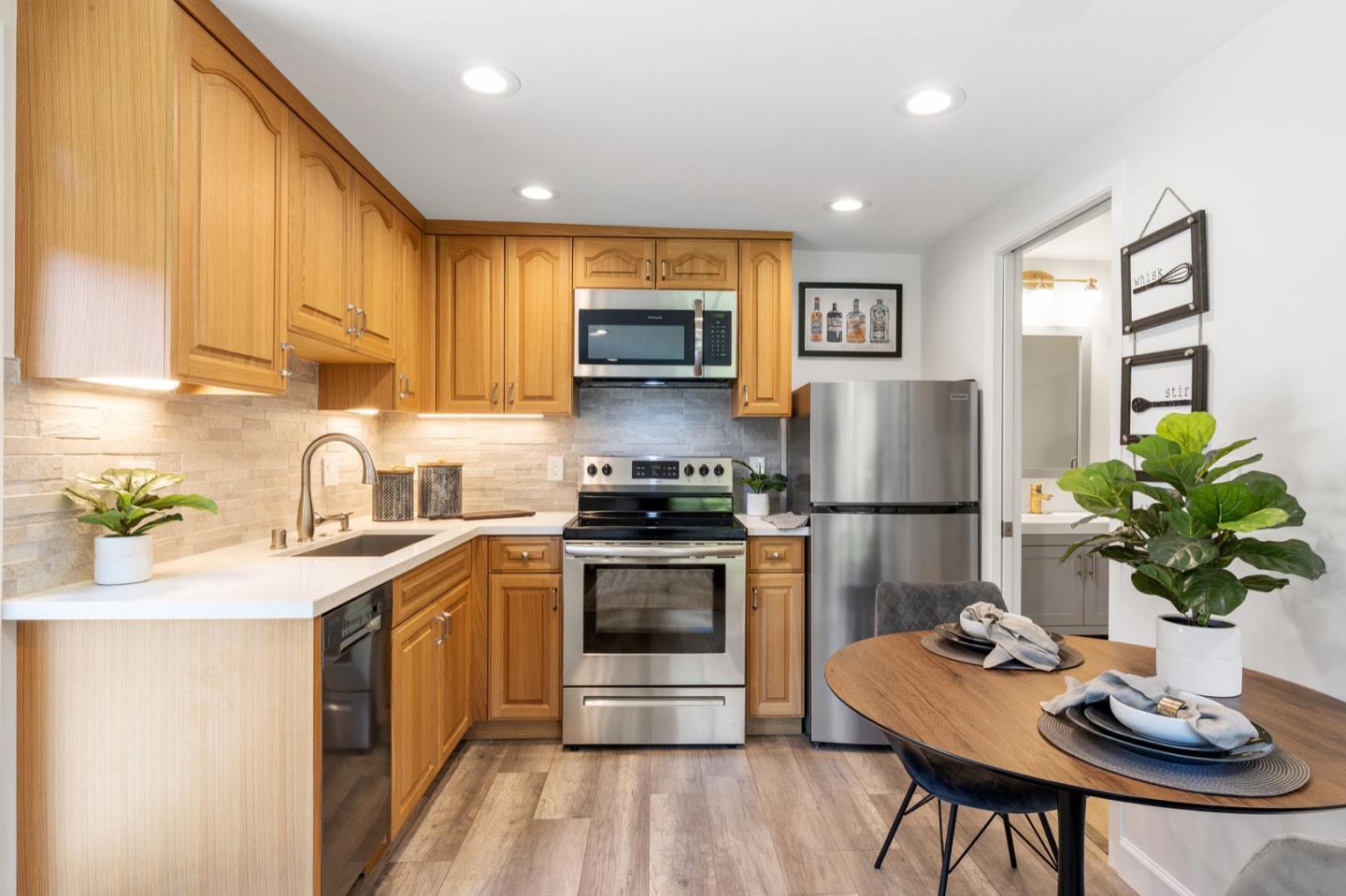 916 Linden Avenue Burlingame, CA 94010 - Photo 52 of 56 a kitchen with stainless steel appliances granite countertop a sink stove and refrigerator