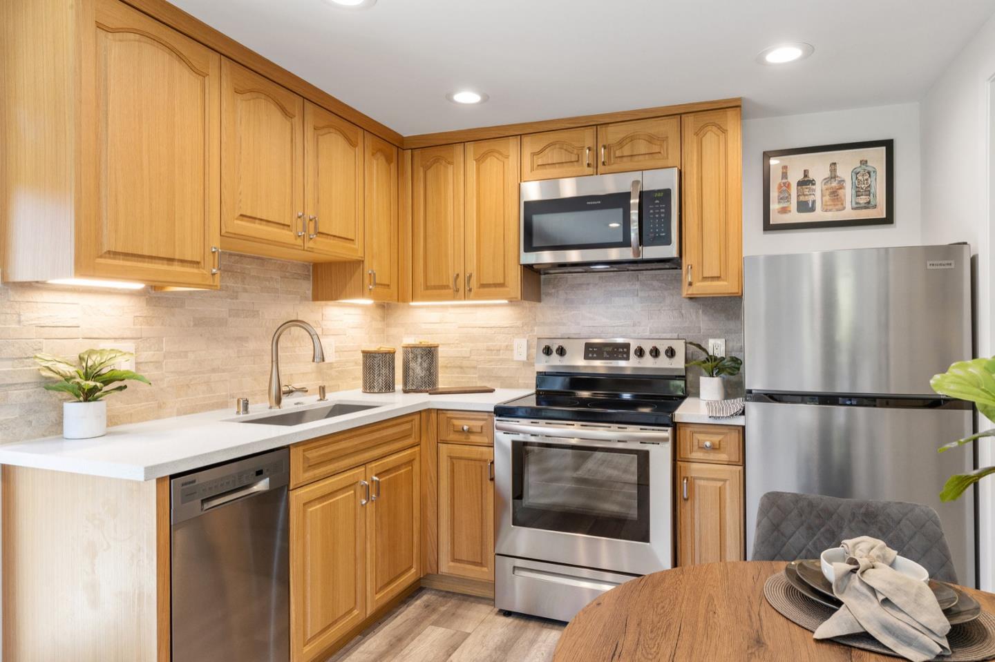 916 Linden Avenue Burlingame, CA 94010 - Photo 53 of 56 a kitchen with a sink cabinets and stainless steel appliances