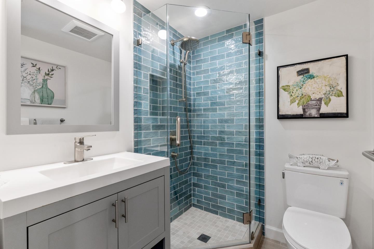 916 Linden Avenue Burlingame, CA 94010 - Photo 55 of 56 a bathroom with a sink mirror and toilet