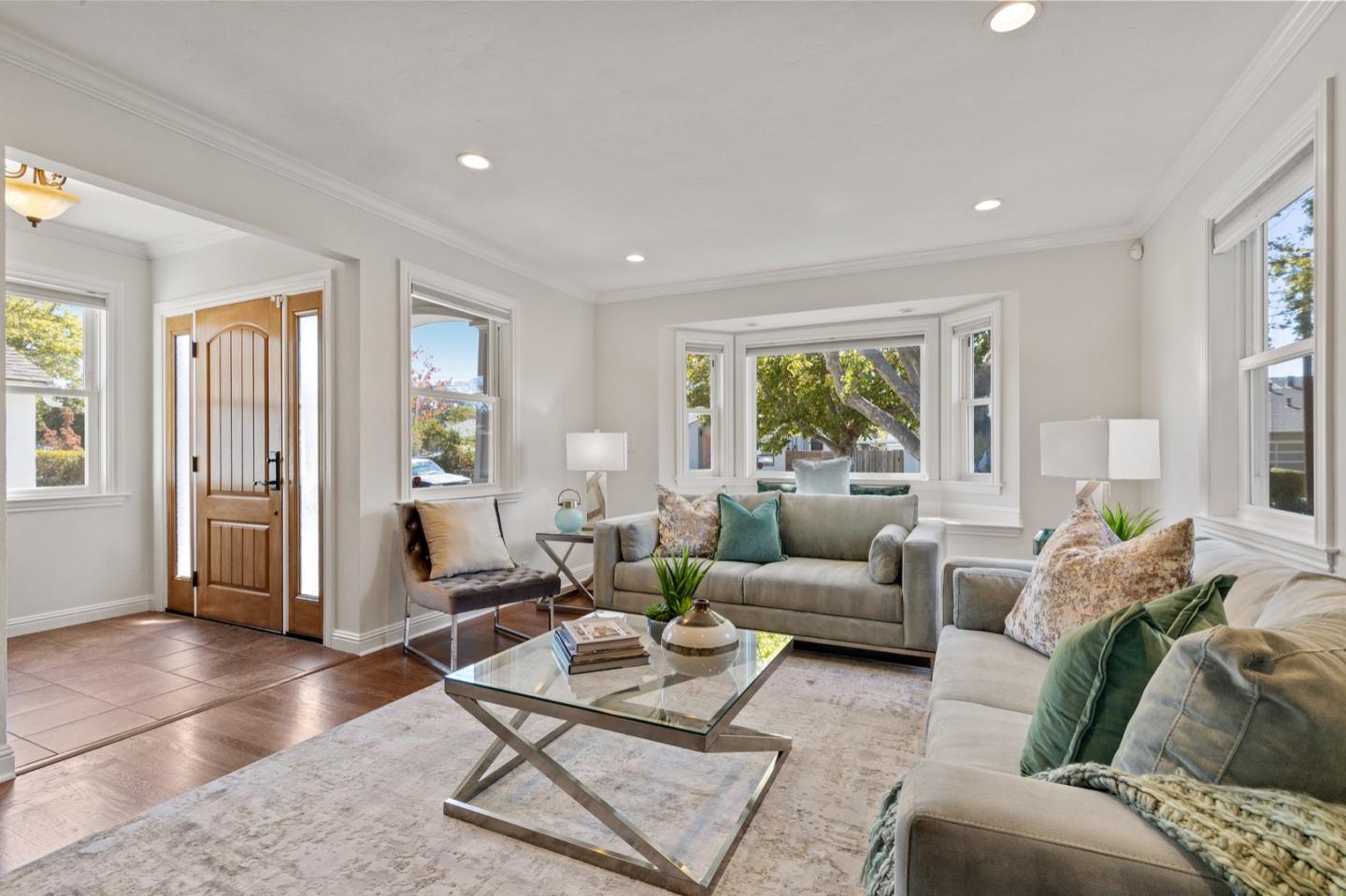 916 Linden Avenue Burlingame, CA 94010 - Photo 10 of 56 a living room with furniture and large windows