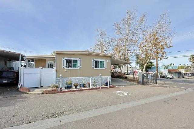 a view of a street that has couple of cars parked on the road