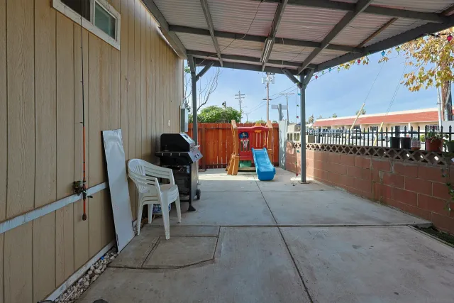 a view of a chairs and table in a patio