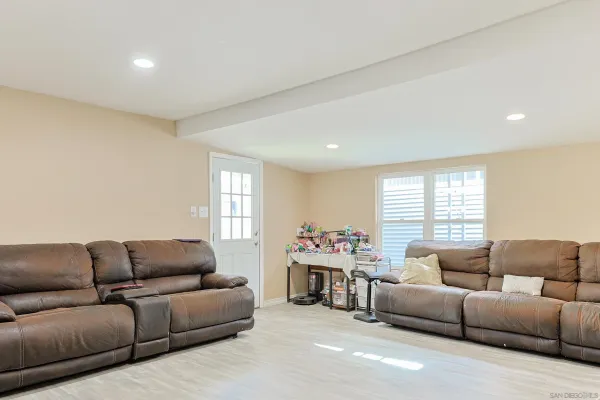 a living room with furniture and a window